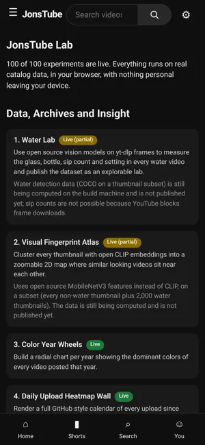 On a phone, the JonsTube Lab hub listing 100 experiments, each marked as fully built or partial